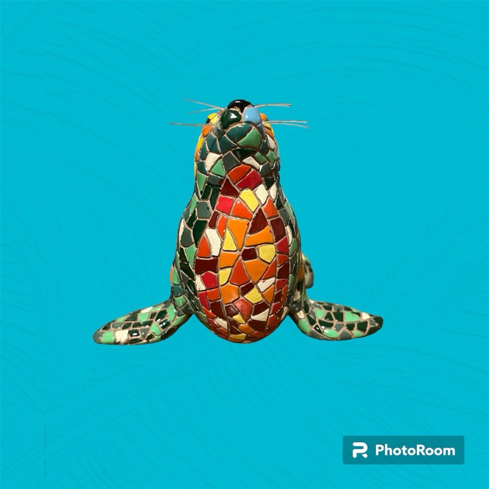 Ceramic design of a seal, very colorful, last photo compared to a penny, decor.